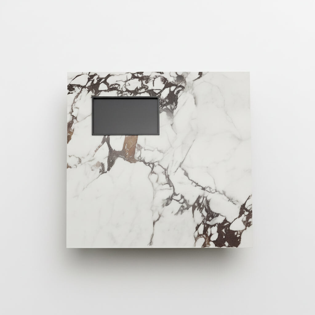 Κάτοψη της λευκής sintered stone επιφάνειας του τραπεζιού Pearl με ενσωματωμένο μαύρο δίσκο