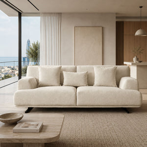 3-seater HAVANA sofa in beige bouclé-like fabric with rounded arms and black legs, in a bright living room.