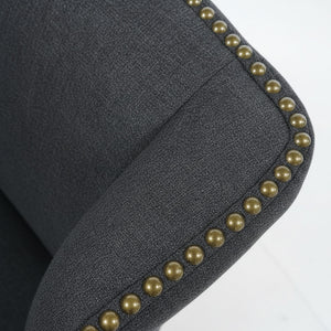Close-up of the decorative studs and the grey fabric of the Elizabeth armchair. / Grey
