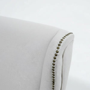 Detail of the decorative studs on the beige Elizabeth armchair. / Yellow