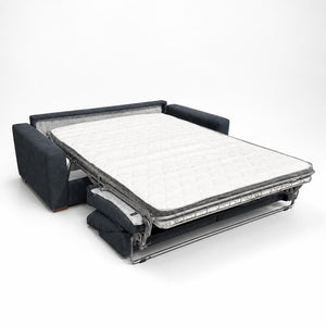 MIRO sofa bed opened into a sleeping surface with a white mattress, a metal mechanism and dark grey side arms
