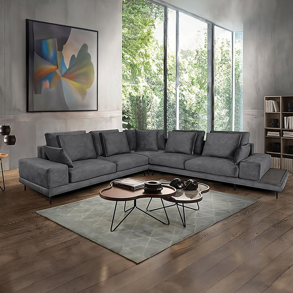 Modern Portofino corner sofa in dark grey, with a deep, plush seat, removable back cushions and wide platform-style arms. / Grey