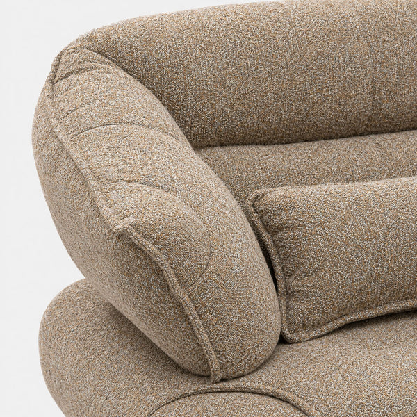 Close-up of the SOFO sofa showing the low-pile mocha brown fabric with a bouclé-like texture and the rounded detail on the arm.